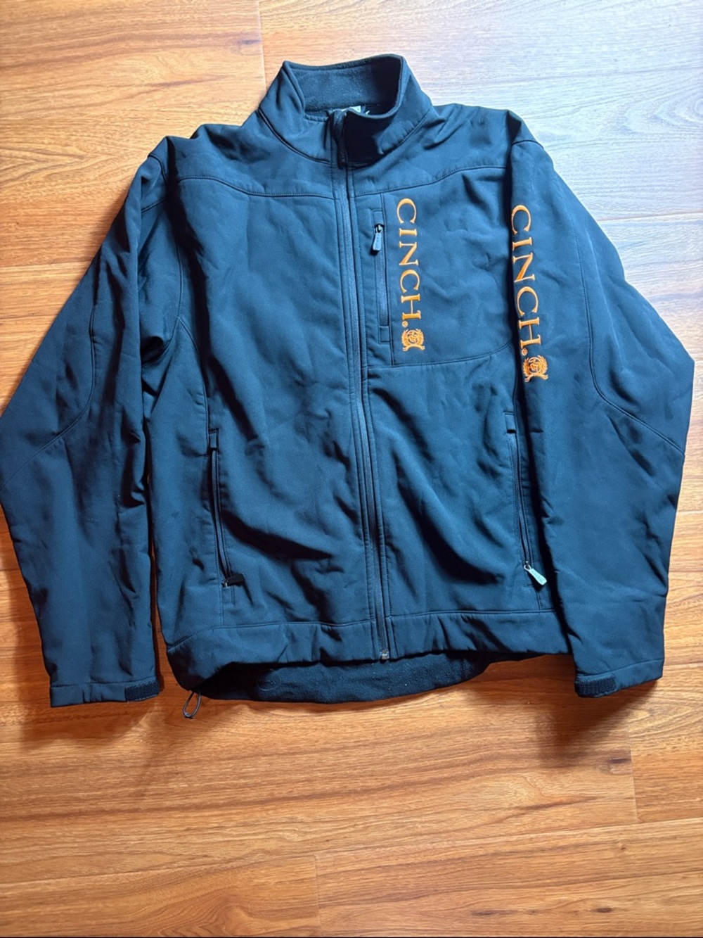 Cinch men’s XL Black Softshell Jacket with Gold Logo Accents